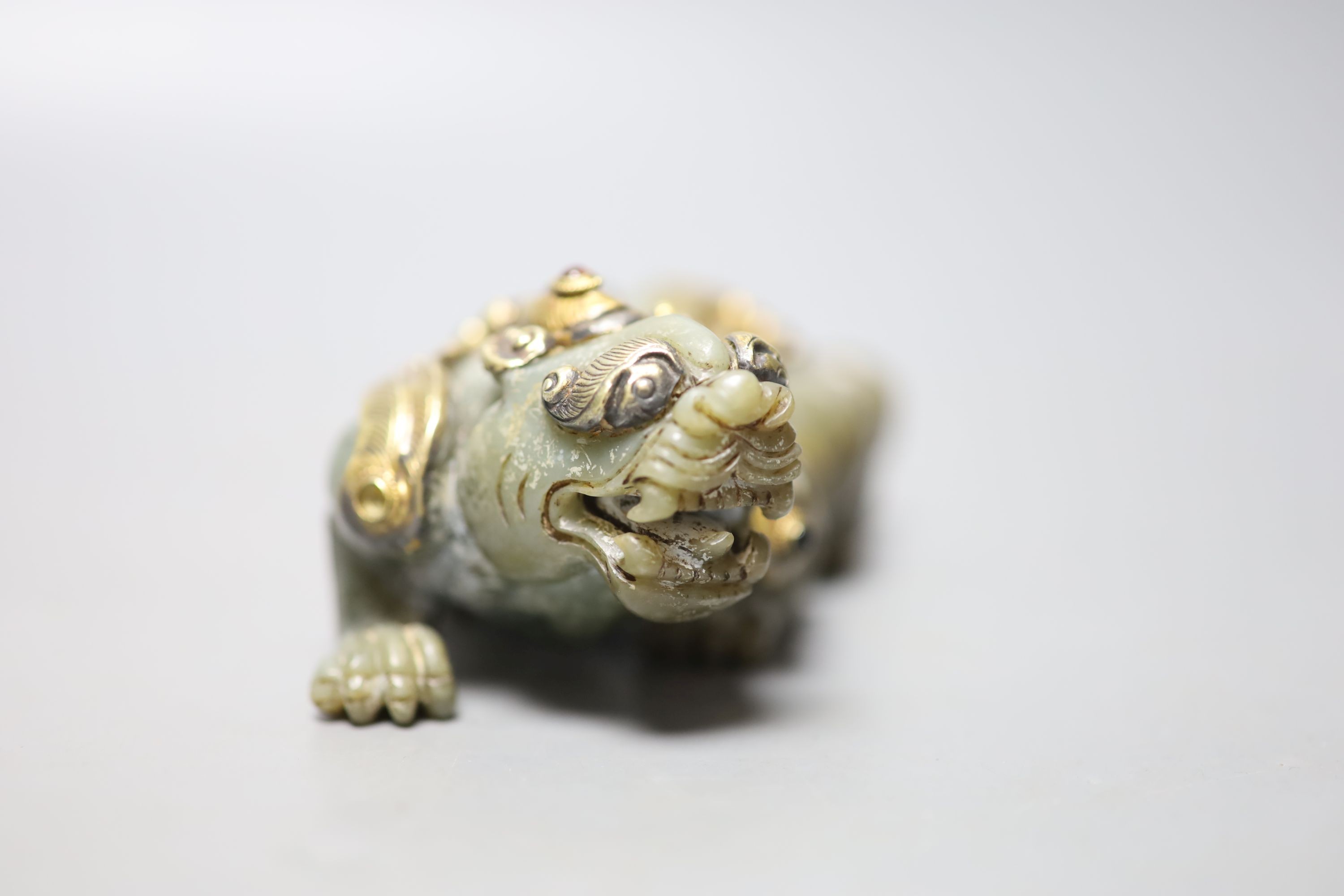 A Chinese celadon jade and gilt metal mounted figure of a Pixiu, 12cm long